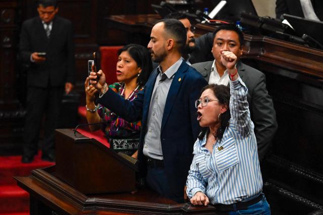 Deputies protest during a Congress session for the election of two magistrates for the Constitutional Court in Guatemala City on March 5, 2026. (Photo by JOHAN ORDONEZ / AFP)