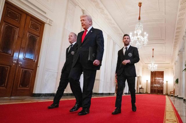 (L/R) Inter Miami's managing owner Jorge Mas, US President Donald Trump and Inter Miami's Argentine forward Lionel Messi arrive for an event honoring the winners of the 2025 Major League Soccer Cup, in the East Room of the White House in Washington, DC, on March 5, 2026. (Photo by ANDREW CABALLERO-REYNOLDS / AFP)