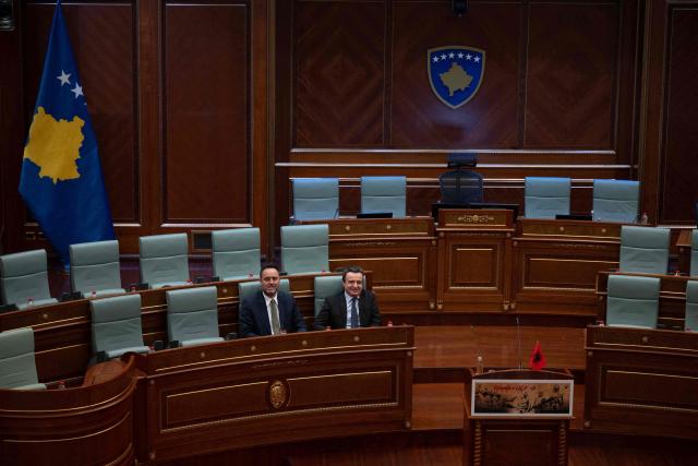 Kosovo Prime Minister Albin Kurti (R) flanked by presidential nominee Glauk Konjufca attends a parliamentary session in Pristina on March 5, 2026, as members of Parliament fail to elect a new president. (Photo by Armend NIMANI / AFP)