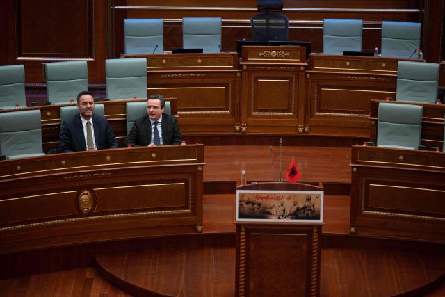 Kosovo Prime Minister Albin Kurti (R) flanked by presidential nominee Glauk Konjufca attends a parliamentary session in Pristina on March 5, 2026, as members of Parliament fail to elect a new president. (Photo by Armend NIMANI / AFP)