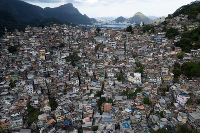 TOPSHOT - This aerial view shows the Rocinha favela, in Rio de Janeiro, Brazil, on March 5, 2026. (Photo by Pablo PORCIUNCULA / AFP)