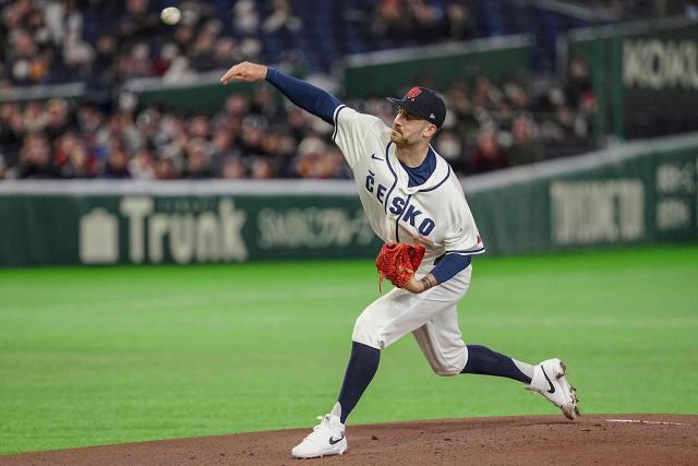 Czech Republic's Tomas Ondra (R) pitches during the World Baseball Classic (WBC) Pool C first round game between Czech Republic and Australia at the Tokyo Dome in Tokyo on March 6, 2026. (Photo by Yuichi YAMAZAKI / AFP)