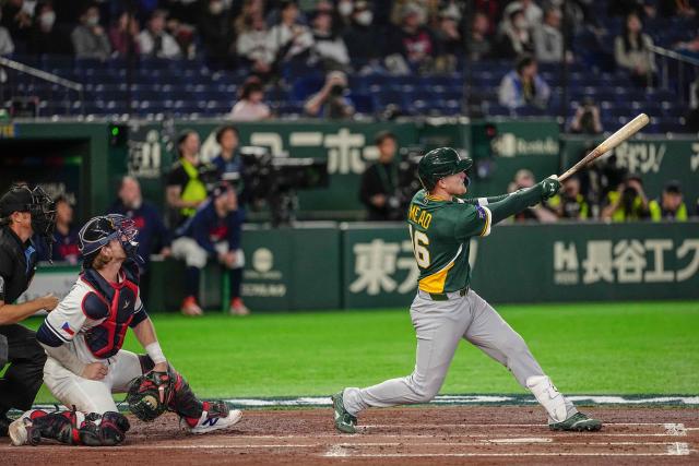 Australia's Curtis Mead (R) hits three-run home run during the World Baseball Classic (WBC) Pool C first round game between Czech Republic and Australia at the Tokyo Dome in Tokyo on March 6, 2026. (Photo by Yuichi YAMAZAKI / AFP)