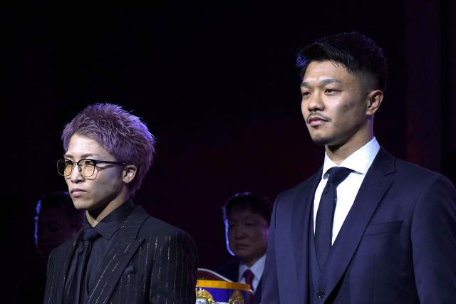 Japanese boxer Naoya Inoue (L), current unified champion of the WBA, WBC, IBF, and WBO world super bantamweight, and his compatriot Junto Nakatani hold a press conference in Tokyo on March 6, 2026. (Photo by Kazuhiro NOGI / AFP)