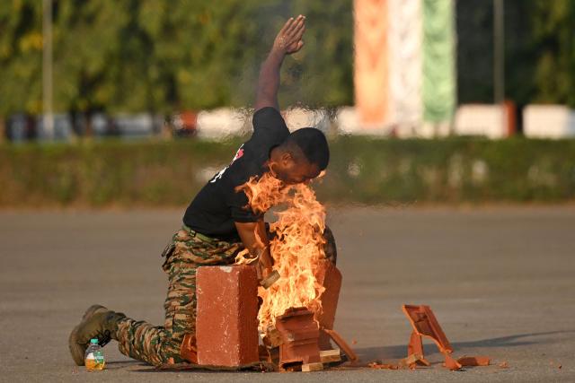 An Indian army cadet displays his skills ahead of the graduation ceremony at the Officers Training Academy in Chennai on March 6, 2026. (Photo by R. Satish BABU / AFP)