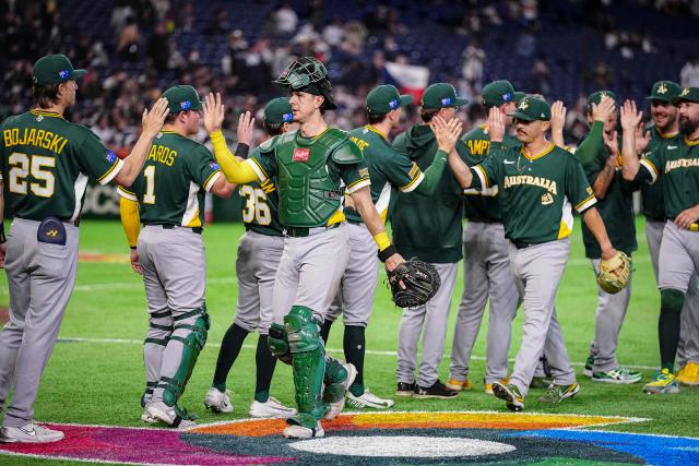 Australia's players celebrate their victory at the end of the World Baseball Classic (WBC) Pool C first round game between Czech Republic and Australia at the Tokyo Dome in Tokyo on March 6, 2026. (Photo by Yuichi YAMAZAKI / AFP)