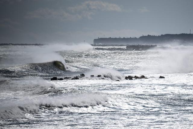 This picture taken on March 5, 2026 shows waves near the Tokyo Electric Power Company's (TEPCO)  Fukushima Daiichi Nuclear Power Plant (not seen in picture), as seen from Ukedo fishing port in Namie, Fukushima prefecture. (Photo by Philip FONG / AFP)