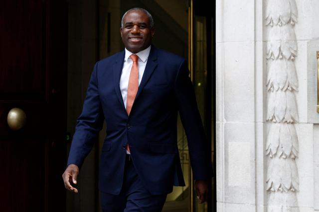 Britain's Justice Secretary and deputy Prime Minister David Lammy smiles as he leaves a television and radio studio in central London on March 6, 2026, after giving interviews. (Photo by Brook Mitchell / AFP)