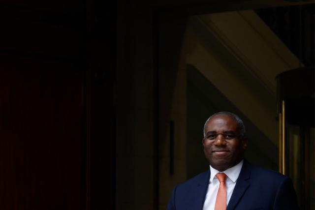 Britain's Justice Secretary and deputy Prime Minister David Lammy smiles as he leaves a television and radio studio in central London on March 6, 2026, after giving interviews. (Photo by Brook Mitchell / AFP)