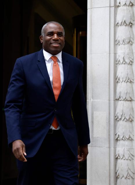 Britain's Justice Secretary and deputy Prime Minister David Lammy smiles as he leaves a television and radio studio in central London on March 6, 2026, after giving interviews. (Photo by Brook Mitchell / AFP)