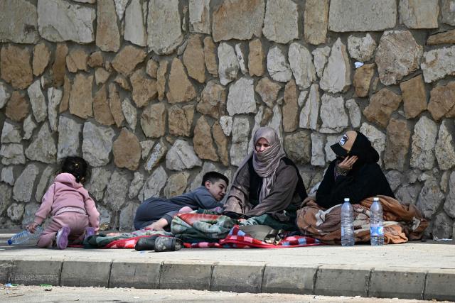 Displaced residents who fled Israeli airstrikes in Beirut's southern suburbs sit along the corniche waterfront in the Lebanese capital on March 6, 2026. Fresh strikes rocked Iran and Lebanon on March 6, as Israel vowed to escalate to a new phase in the Middle East war that has spiralled rapidly throughout the region and beyond. (Photo by Joseph EID / AFP)