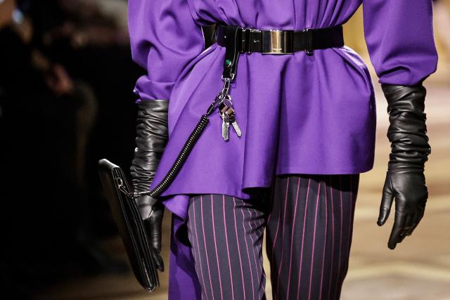 A model presents gloves and a belt for Mugler for the Women's Ready to Wear Fall/Winter 2026-2027 collection fashion show as part of the Paris Women Fashion Week, in Paris, on March 6, 2026. (Photo by STEPHANE DE SAKUTIN / AFP)
