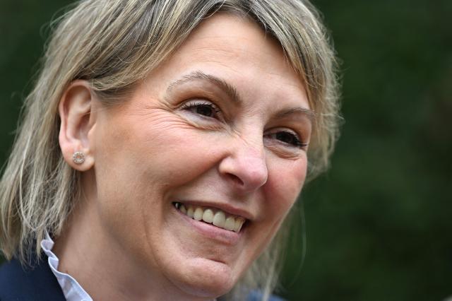 EDITORS NOTE: Graphic content / French far-right party Rassemblement National (RN)'s mayoral candidate of Bourg-Saint-Andeol Celine Porquet looks on during a campaign visit ahead of France's upcoming municipal elections in Bourg-Saint-Andeol, southern France on March 6, 2026. French voters head to the polls for municipal elections on March 15 and 22, 2026. (Photo by Miguel MEDINA / AFP)