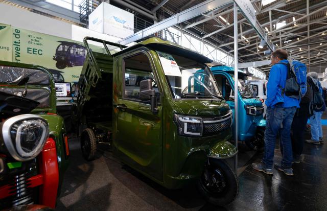 People visit the ‚Cargotrike‘ stand with electrically operated three wheelers at the "International Craft Fair 2026" (Internationale Handwerksmesse - IHM) in Munich, southern Germany, on March 6, 2026. The "International Craft Fair 2026" (Internationale Handwerksmesse - IHM) takes place from  March 4 to 8, 2026 in Munich. (Photo by Michaela STACHE / AFP)