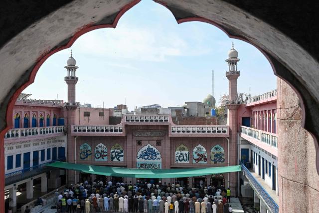 Muslim devotees offer Friday prayers during the holy fasting month of Ramadan at a mosque in Lahore on March 6, 2026. (Photo by Arif ALI / AFP)