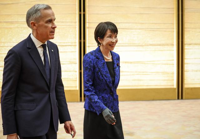 Canada's Prime Minister Mark Carney (L) and Japan's Prime Minister Sanae Takaichi attend a joint press conference in Tokyo on March 6, 2026. (Photo by Takashi Aoyama / POOL / AFP)