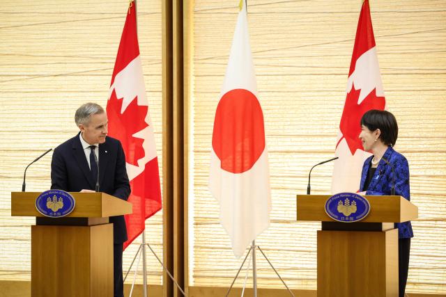 Canada's Prime Minister Mark Carney (L) and Japan's Prime Minister Sanae Takaichi attend a joint press conference in Tokyo on March 6, 2026. (Photo by Takashi Aoyama / POOL / AFP)