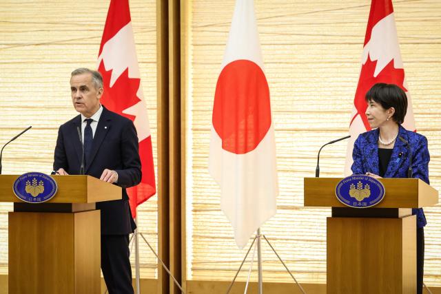 Canada's Prime Minister Mark Carney (L) and Japan's Prime Minister Sanae Takaichi attend a joint press conference in Tokyo on March 6, 2026. (Photo by Takashi Aoyama / POOL / AFP)