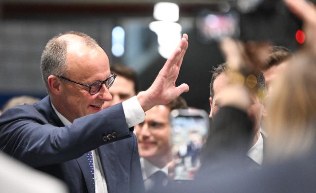 German Chancellor and Chairman of the Christian Democratic Party (CDU) Friedrich Merz waves the audience as he arrives for an election campaign event in Stockach, southern Germany, on March 6, 2026. Voters will go to the polls in the prosperous southwestern state of Baden-Wuerttemberg on March 8, 2026. (Photo by THOMAS KIENZLE / AFP)
