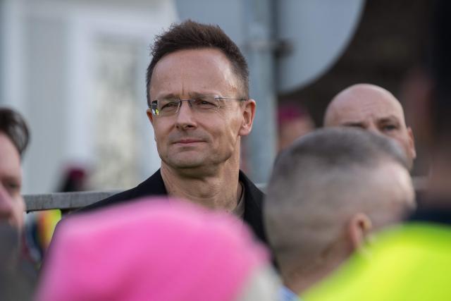Hungarian Minister of Economy and Foreign Affairs Peter Szijjarto attends a demonstration in support of the Hungarian government against Ukraine's President Zelensky in front of the Ukrainian Embassy in Budapest, on March 6, 2026. Hungary will expel seven detained Ukrainians, the government said on March 6, as Hungarian Prime Minister Orban and Ukrainian President Zelensky traded threats in a row over stalled Russian oil supplies. Kyiv accused Budapest of having kidnapped seven of its citizens, as Orban said he would use "every means" to pressure Ukraine over the Russian oil. A day earlier, Zelensky appeared to have issued a direct threat against Orban, saying Ukraine's armed forces would "talk to him in their own language" -- a statement condemned by Hungary and the EU. Hungary and Slovakia say Ukraine is deliberately delaying reopening a key pipeline pumping Russian oil to the two landlocked EU member states, which Kyiv says was damaged by Russian strikes in January. (Photo by Ferenc ISZA / AFP)