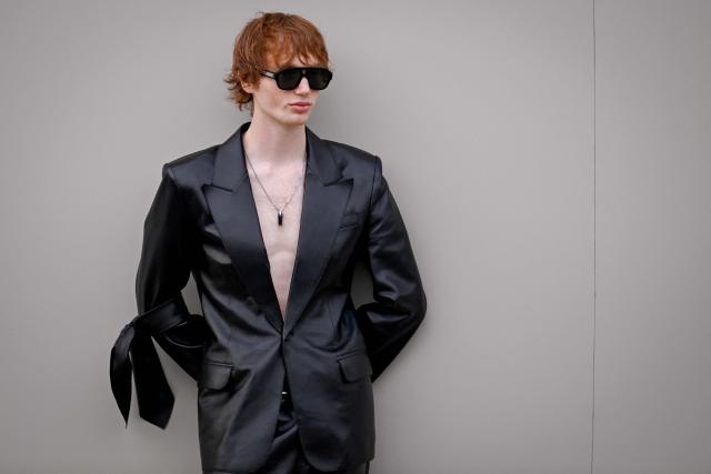 British model Calum Harper arrives ahead of the Givenchy Women's Ready to Wear Fall/Winter 2026-2027 collection fashion show as part of the Paris Women Fashion Week, in Paris, on March 6, 2026. (Photo by Julie SEBADELHA / AFP)