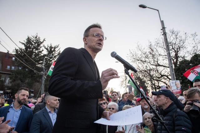 Hungarian Minister of Economy and Foreign Affairs Peter Szijjarto speaks during a demonstration in support of the Hungarian government against Ukraine's President Zelensky in front of the Ukrainian Embassy in Budapest, on March 6, 2026. Hungary will expel seven detained Ukrainians, the government said on March 6, as Hungarian Prime Minister Orban and Ukrainian President Zelensky traded threats in a row over stalled Russian oil supplies. Kyiv accused Budapest of having kidnapped seven of its citizens, as Orban said he would use "every means" to pressure Ukraine over the Russian oil. A day earlier, Zelensky appeared to have issued a direct threat against Orban, saying Ukraine's armed forces would "talk to him in their own language" -- a statement condemned by Hungary and the EU. Hungary and Slovakia say Ukraine is deliberately delaying reopening a key pipeline pumping Russian oil to the two landlocked EU member states, which Kyiv says was damaged by Russian strikes in January. (Photo by Ferenc ISZA / AFP)