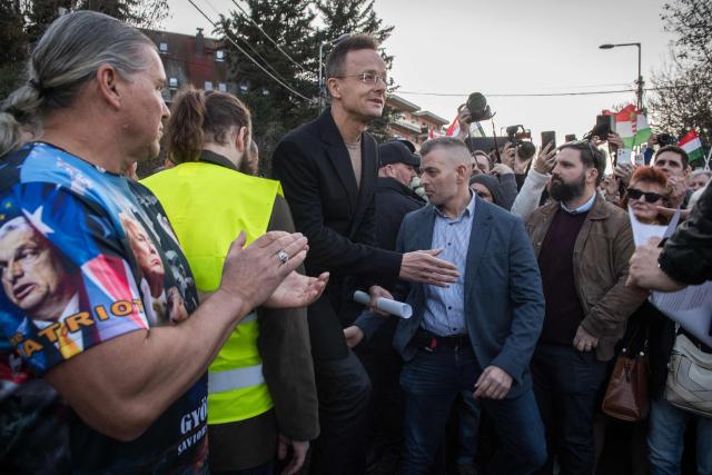 Hungarian Minister of Economy and Foreign Affairs Peter Szijjarto arrives to a demonstration in support of the Hungarian government against Ukraine's President Zelensky in front of the Ukrainian Embassy in Budapest, on March 6, 2026. Hungary will expel seven detained Ukrainians, the government said on March 6, as Hungarian Prime Minister Orban and Ukrainian President Zelensky traded threats in a row over stalled Russian oil supplies. Kyiv accused Budapest of having kidnapped seven of its citizens, as Orban said he would use "every means" to pressure Ukraine over the Russian oil. A day earlier, Zelensky appeared to have issued a direct threat against Orban, saying Ukraine's armed forces would "talk to him in their own language" -- a statement condemned by Hungary and the EU. Hungary and Slovakia say Ukraine is deliberately delaying reopening a key pipeline pumping Russian oil to the two landlocked EU member states, which Kyiv says was damaged by Russian strikes in January. (Photo by Ferenc ISZA / AFP)