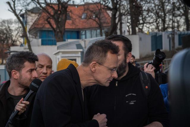 Hungarian Minister of Economy and Foreign Affairs Peter Szijjarto arrives to a demonstration in support of the Hungarian government against Ukraine's President Zelensky in front of the Ukrainian Embassy in Budapest, on March 6, 2026. Hungary will expel seven detained Ukrainians, the government said on March 6, as Hungarian Prime Minister Orban and Ukrainian President Zelensky traded threats in a row over stalled Russian oil supplies. Kyiv accused Budapest of having kidnapped seven of its citizens, as Orban said he would use "every means" to pressure Ukraine over the Russian oil. A day earlier, Zelensky appeared to have issued a direct threat against Orban, saying Ukraine's armed forces would "talk to him in their own language" -- a statement condemned by Hungary and the EU. Hungary and Slovakia say Ukraine is deliberately delaying reopening a key pipeline pumping Russian oil to the two landlocked EU member states, which Kyiv says was damaged by Russian strikes in January. (Photo by Ferenc ISZA / AFP)