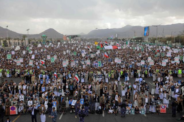 Houthis rally in solidarity with Iran and Lebanon, amid the US-Israeli conflict with Iran, in the Yemeni capital Sanaa on March 6, 2026. The US president on March 6, demanded Iran's "unconditional surrender" as the only acceptable outcome to end hostilities, while promising to help rebuild the country's economy if Tehran complied. (Photo by Mohammed HUWAIS / AFP)