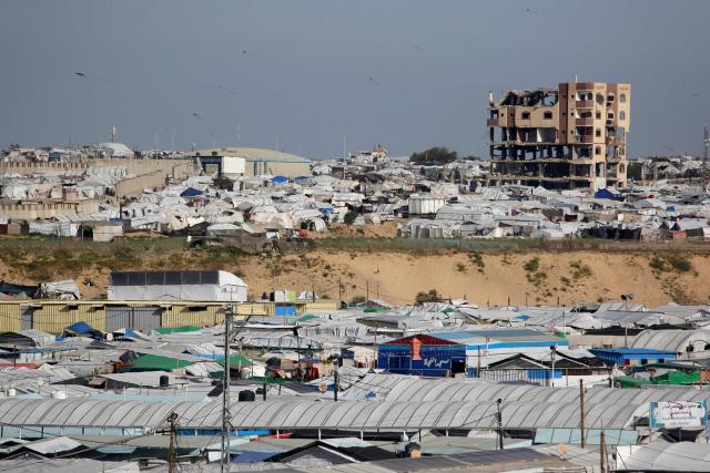 Hundreds of tents are set up in the sand to house displaced Palestinians who lost their homes and businesses during Israeli military bombardment of the Gaza Strip, in Khan Yunis, in the south of the Gaza Strip on March 6, 2026. The majority of Gaza's 2.4 million people have been displaced, often multiple times, by the war that began with Hamas's attack on southern Israel on October 7, 2023. With displaced families living in tented camps, with serious concerns raised over their living conditions. (Photo by Bashar Taleb / AFP)