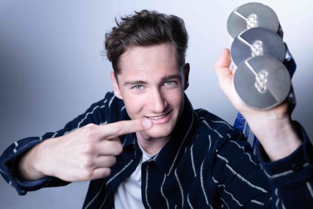 French cross-country skier Mathis Desloges poses with the 3 silver medals he won at the Milan Cortina Winter Olympics during a photo session in Paris on March 6, 2026. (Photo by Joel Saget / AFP)