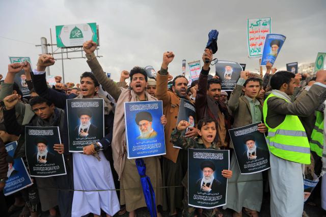 Houthi supporters shout slogans and hold portraits of Iran's slain supreme leader Ayatollah Ali Khamenei during a rally in solidarity with Iran and Lebanon, amid the US-Israeli conflict with Iran, in the Yemeni capital Sanaa on March 6, 2026. The US president on March 6, demanded Iran's "unconditional surrender" as the only acceptable outcome to end hostilities, while promising to help rebuild the country's economy if Tehran complied. (Photo by Mohammed HUWAIS / AFP)