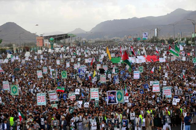 Houthi supporters hold portraits of Iran's slain supreme leader Ayatollah Ali Khamenei during a rally in solidarity with Iran and Lebanon, amid the US-Israeli conflict with Iran, in the Yemeni capital Sanaa on March 6, 2026. The US president on March 6, demanded Iran's "unconditional surrender" as the only acceptable outcome to end hostilities, while promising to help rebuild the country's economy if Tehran complied. (Photo by Mohammed HUWAIS / AFP)
