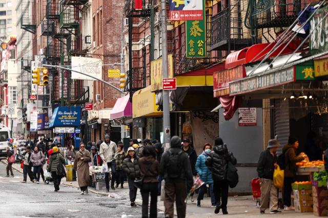 People move along a street of Chinatown in the Manhattan borough of New York City on March 6, 2026. (Photo by CHARLY TRIBALLEAU / AFP)
