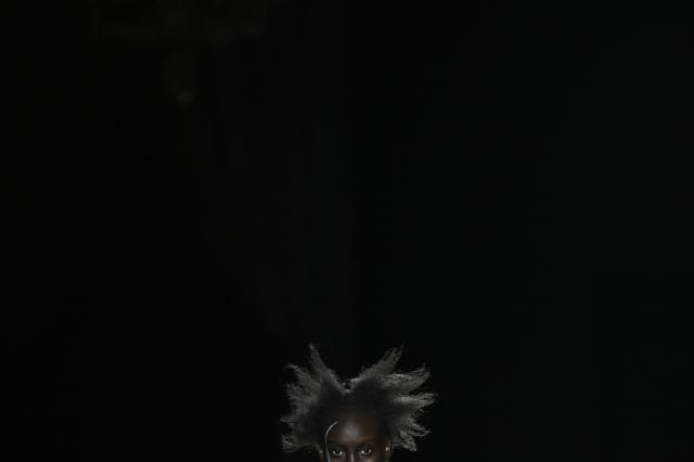 TOPSHOT - A model presents a creation by Yohji Yamamoto for the Women's Ready to Wear Fall/Winter 2026-2027 collection fashion show as part of the Paris Women Fashion Week, in Paris, on March 6, 2026. (Photo by JULIEN DE ROSA / AFP)