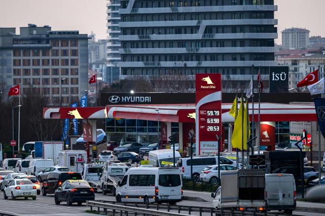 People queue at a petrol station in Istanbul on March 6, 2026 as fears have grown of a possible inflationary wave as war in the Middle East sends energy prices shooting upwards. Many countries are watching for the impact on petrol prices du to turmoil in the Middle East after US and Israeli strikes on Iran, with the vital Strait of Hormuz effectively shut and several ships attacked. (Photo by Yasin AKGUL / AFP)