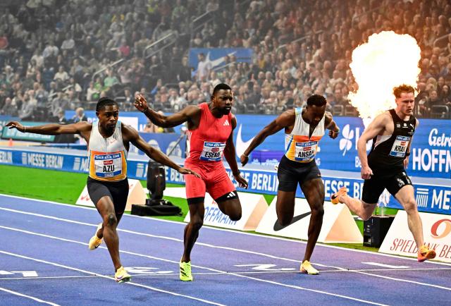 (L_R) Britain's Jeremiah Azu, Cameroon's Emmanual Eseme, Germany's Owen Ansah and Germany's Kevin Kranz compete during the men's 60m event of the ISTAF indoor Athletics Meeting 2026 in Berlin on March 6, 2026. (Photo by Tobias SCHWARZ / AFP)