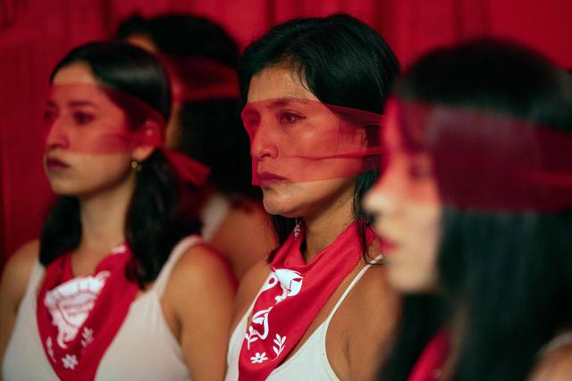jMarisela (L) and Marcia Monzon, daughters of Celia Ramos, a woman who was victim of a forced sterilization, are seen during a performance at the DEMUS Reproductive Rights Center during a press conference in Lima on March 6, 2026. The daughters of a peasant woman who died in 1997 from a forced sterilization in Peru emphasized that the Inter-American Court of Human Rights "did justice" after the ruling that recognizes the responsibility of the authorities for a practice that affected some 300,000 women in the decade of the 1990s. (Photo by Ernesto BENAVIDES / AFP)