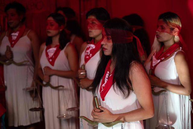 jMarisela (L) and Marcia Monzon, daughters of Celia Ramos, a woman who was victim of a forced sterilization, are seen during a performance at the DEMUS Reproductive Rights Center in Lima on March 6, 2026. The daughters of a peasant woman who died in 1997 from a forced sterilization in Peru emphasized that the Inter-American Court of Human Rights "did justice" after the ruling that recognizes the responsibility of the authorities for a practice that affected some 300,000 women in the decade of the 1990s. (Photo by Ernesto BENAVIDES / AFP)