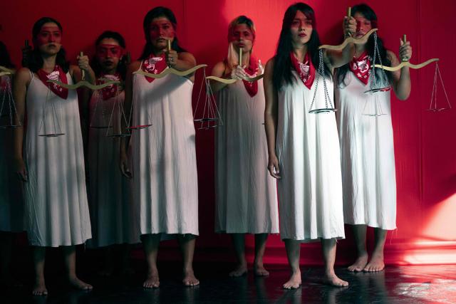 jMarisela (L) and Marcia Monzon, daughters of Celia Ramos, a woman who was victim of a forced sterilization, are seen during a performance at the DEMUS Reproductive Rights Center in Lima on March 6, 2026. The daughters of a peasant woman who died in 1997 from a forced sterilization in Peru emphasized that the Inter-American Court of Human Rights "did justice" after the ruling that recognizes the responsibility of the authorities for a practice that affected some 300,000 women in the decade of the 1990s. (Photo by Ernesto BENAVIDES / AFP)