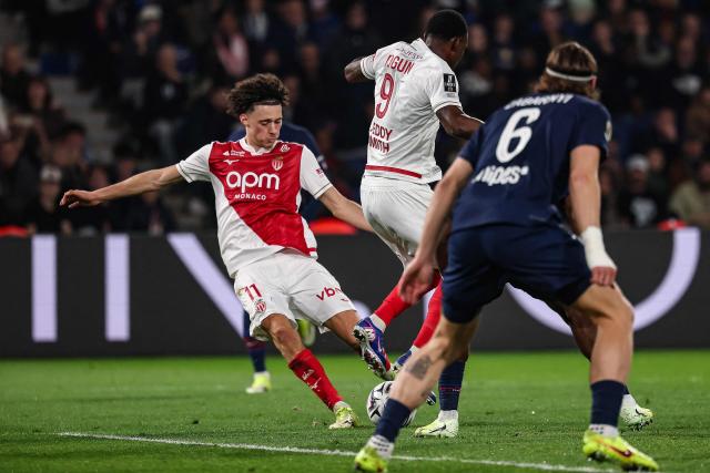 Monaco's French midfielder #11 Maghnes Akliouche (L) shoots and scores the opening goal during the French L1 football match between Paris Saint-Germain (PSG) and AS Monaco at the Parc des Princes stadium in Paris on March 6, 2026. (Photo by FRANCK FIFE / AFP)