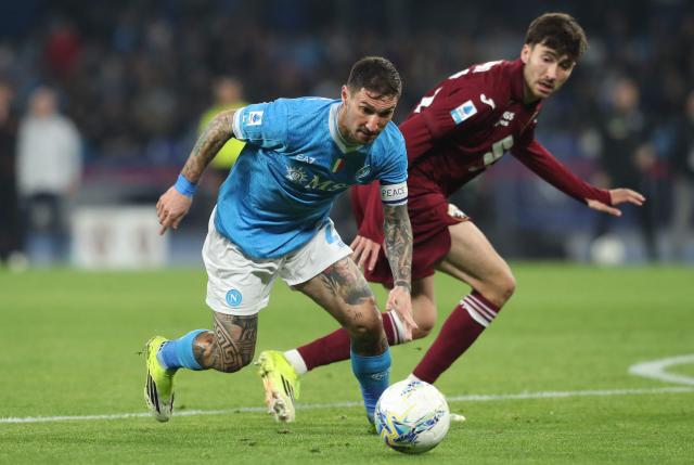 Napoli's Italian forward #21 Matteo Politano (L) and Torino's Spanish defender #33 Rafael Obrador (R) fight for the ball during the Italian Serie A football between match SSC Napoli and Torino FC at the Diego Armando Maradona Stadium in Napoli, on March 6, 2026. (Photo by CARLO HERMANN / AFP)