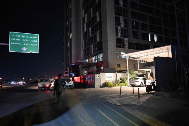 Security inspect outside the Erbil Arjaan by Rotana hotel, in Erbil, the capital of Iraq's autonomous Kurdistan region on March 6, 2026. The US-led coalition in Iraq intercepted on March 6, 2026 explosive-laden drones over the Kurdish city of Erbil where debris fell near a hotel, Kurdish security forces said. (Photo by Ozan KOSE / AFP)