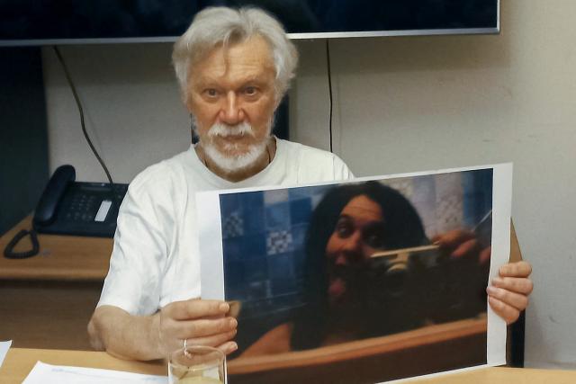 French national Jean Michel Bouvier shows a portrait of his daughter Cassandre Bouvier, one of the two French women murdered in 2011, during a press conference in Buenos Aires on March 6, 2026. Jean Michel Bouvier, the father of Cassandre Bouvier, one of the two French women murdered in 2011 in northwestern Argentina, is in Buenos Aires to be questioned by Argentine authorities as part of the investigation reopened in 2025, he told reporters on March 6. (Photo by Philippe BERNES-LASSERRE / AFP)