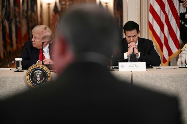 US President Donald Trump and Secretary of State Marco Rubio attend a roundtable to "save college sports" in the East Room of the White House in Washington, DC, on March 6, 2026. (Photo by Brendan SMIALOWSKI / AFP)