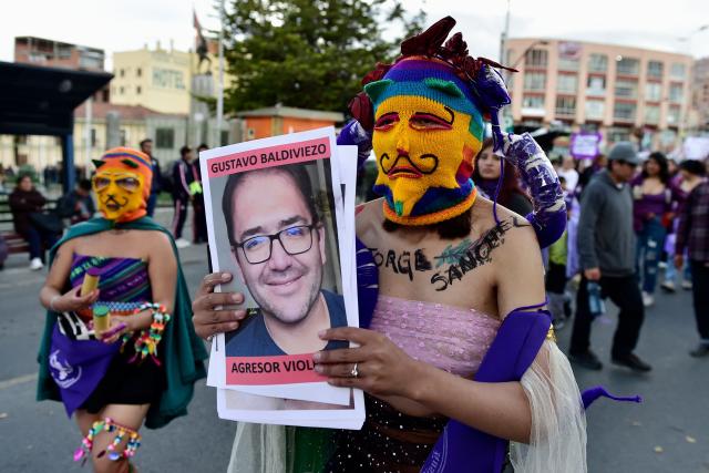 Feminist groups perform during a march against government on the eve of International Women's Day in La Paz on March 6, 2026. The International Women's Rights Day will fall on March 8, 2026. (Photo by Jorge BERNAL / AFP)