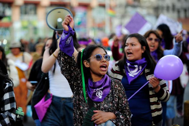 A feminist group member shouts slogans during a march against the government on the eve of International Women's Day in La Paz on March 6, 2026. The International Women's Rights Day will fall on March 8, 2026. (Photo by Jorge BERNAL / AFP)