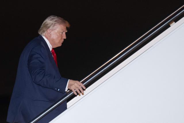 US President Donald Trump boards Air Force One at Joint Base Andrews, Maryland, as he departs for Florida, on March 6, 2026. President Trump is on his way to his Mar-a-Lago resort where he will host the "Shield of the Americas" summit with right-wing Latin American leaders focusing on security and democracy on March 7. (Photo by SAUL LOEB / AFP)