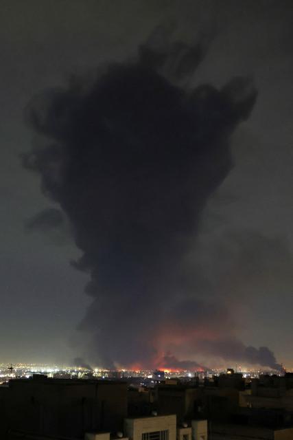 Smoke rises from the site of airstrikes at Mehrabad International Airport in Tehran on March 7, 2026. Israel said on March 7 it had launched "broad-scale" strikes on targets in Tehran, as the Iranian state broadcaster reported an explosion in the western part of the city. (Photo by ATTA KENARE / AFP)