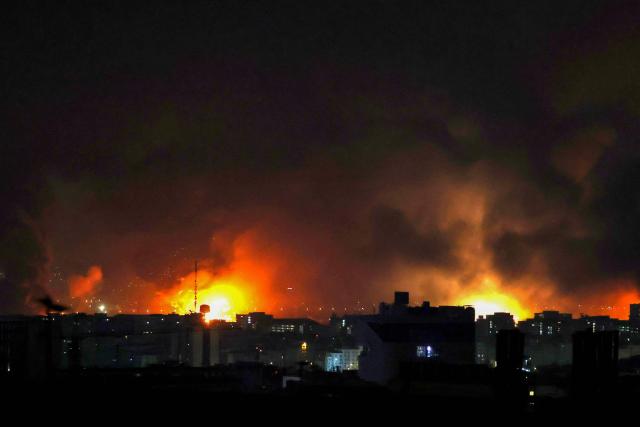 Smoke and fire rise from the site of airstrikes at Mehrabad International Airport in Tehran on March 7, 2026. Israel said on March 7 it had launched "broad-scale" strikes on targets in Tehran, as the Iranian state broadcaster reported an explosion in the western part of the city. (Photo by ATTA KENARE / AFP)